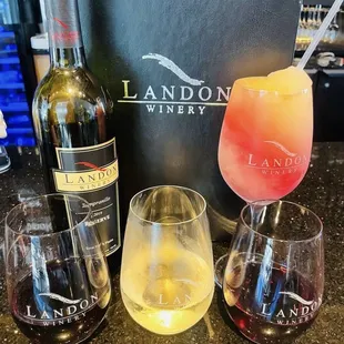 Tempranillo bottle and wine in front (sooo good), Peach (white), raspberry and swirl