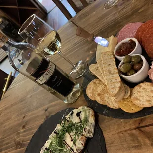 Spinach and artichoke flat bread and a charcuterie board.