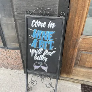 a sign for a wine bar