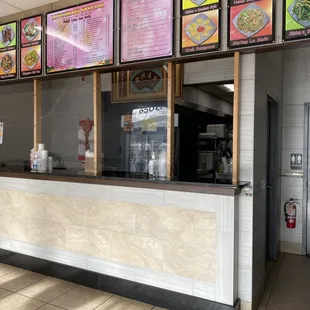 a restaurant counter with menus