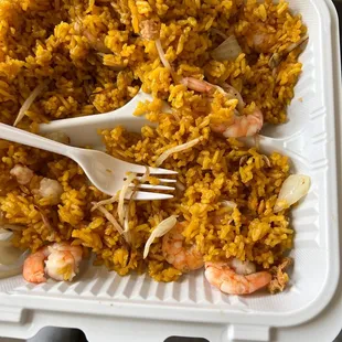 shrimp and rice in a styrofoam container