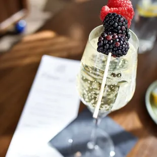 Prosecco with berries off the mimosa cart