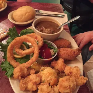 a plate of fried shrimp and onion rings