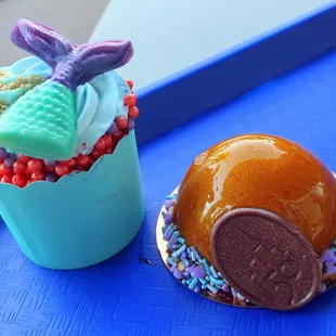 a cupcake and a cupcake on a blue tray