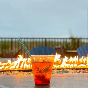 a drink in front of a fire