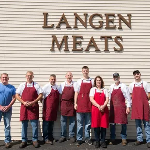 a group of people in aprons