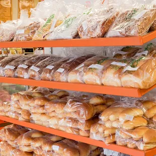 a variety of breads on shelves