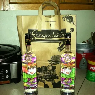 two bottles and a paper bag