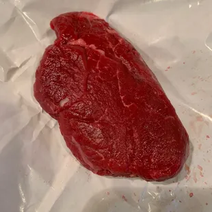 Langenstein&apos;s center cut filet sold to a shopper.  Flat, thin, no mareling, not center cut.  This is 6.75 oz.  Not happy.