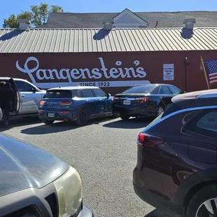 Parking lot in front with store signage