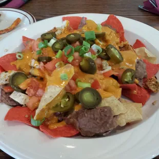 Nachos with grilled chicken.   Not a fan of cheese whiz on my nachos.