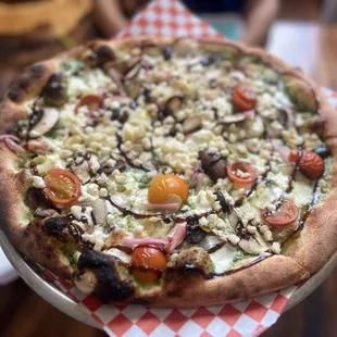 Pesto pizza with goat cheese and Mac nuts -interesting but not for me