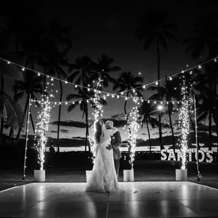 Bride and groom&apos;s first dance at Wedding Reception at Lanikuhonua Cultural Institute - Wedding Photography by HNL Studios www.hnlstudios.com
