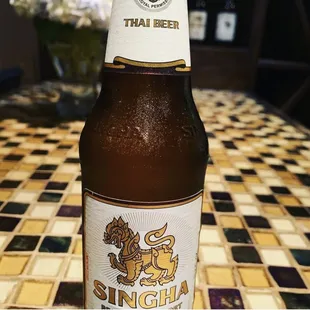 Singha Beer - a pale lager beer from Thailand.  The original Thai beer since 1933.