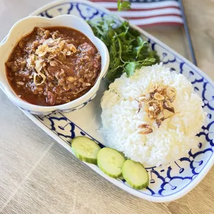 Nam Prik Ong( grounded chicken in Thai paste with tomatoes) serve with white rice.