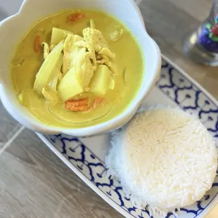 Yellow curry serve with white rice.
