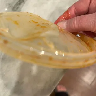 Warped lis from to go container.