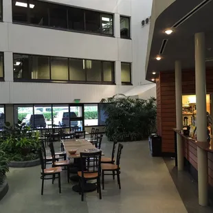 a view of a restaurant with tables and chairs