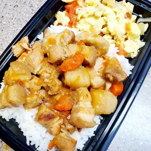a meal of rice, chicken, and vegetables