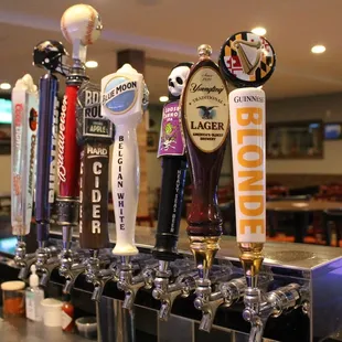 a row of beer taps