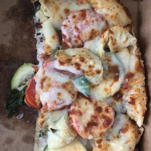 Half of a personal size veggie supreme to go !