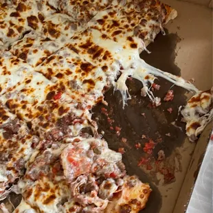 Ridiculous amount of grease to where the cheese falls right off when the pizza is moved, as you can see