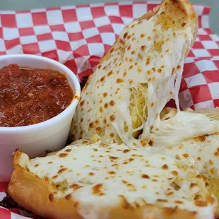 a grilled cheese sandwich with a side of salsa
