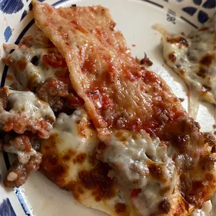 This is what the pizza slices end up looking like because the cheese won&apos;t stay on due to saturation from grease.