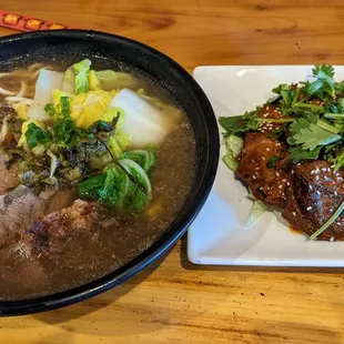 Basic bowl of noodles with beef and veges, and spicy beef and tripe on the right
