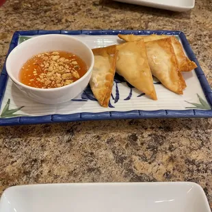 a bowl of soup and a pair of sambobs