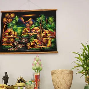 a painting of a village in the background