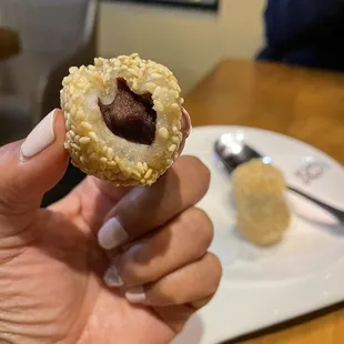 Red bean paste inside the sesame balls