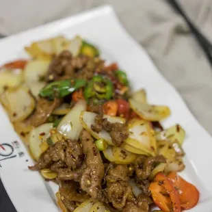 beef and vegetables on a plate