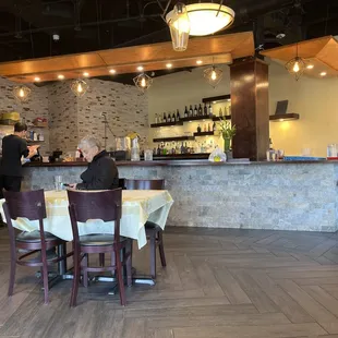 a man sitting at a table in a restaurant