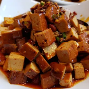 Crispy peanut with dry bean curd ($9), vegan by default. Really tasty.