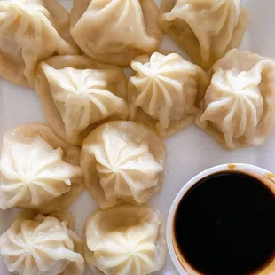 a plate of steamed dumplings