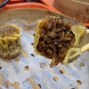 Shao Mai 烧卖 - sticky rice steamed with pork fat in a wonton wrapper.