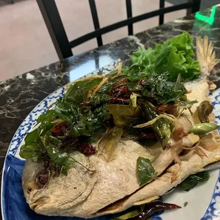 Fried Pompano fish with spicy sauce