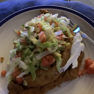 Beef &amp; Cheese Sopapilla with lettuce, tomatoes &amp; sour cream.