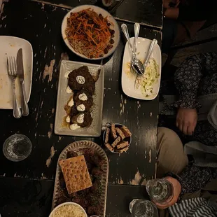 Qabuli palow, mixed grill, buranee bademjan, and fries with harissa aioli