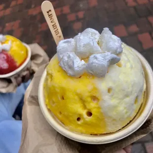 Shaved ice with vanilla ice cream on the bottom. Flavors on top: pineapple, passion fruit &amp; mango.  Snow topped with Mochi.