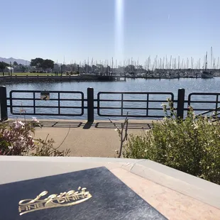 Table by the water, perfect for people watching the cyclist ride by and kayakers taking lessons
