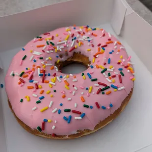 The Big Pink. $10.99. Giant donut with sweet, creamy frosting, and sprinkles. Lard Lad Donuts at Universal Studios Florida.