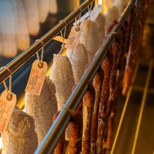 a display of sausages on a rack