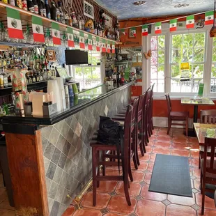 a view of the bar and dining area