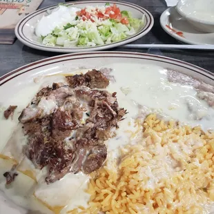 Cheese enchiladas with carnitas on top. Delicious