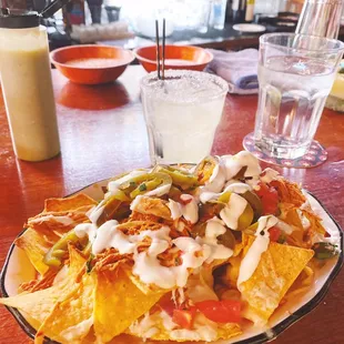 $6 happy hour nachos and $12 scratch marg