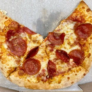 Pepperoni pizza (with one slice already eaten!)