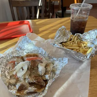 The chicken gyro open and the delicious fries