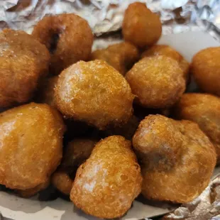 a plate of fried doughnuts